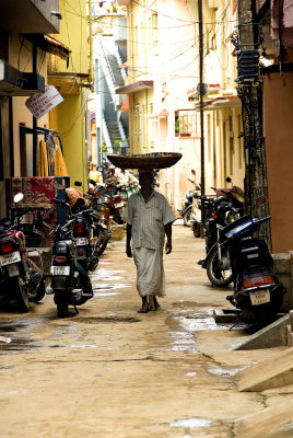 Man with basket on head