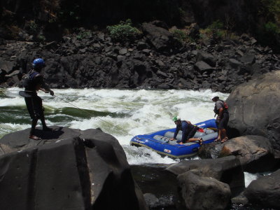 Day 1 Pulling the raft up through rapid 1.JPG
