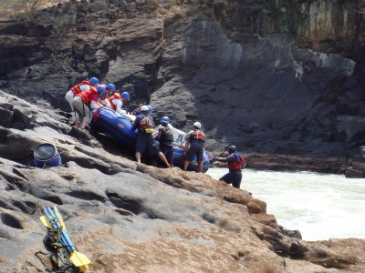 Day 5 Dropping the rafts over the falls.JPG