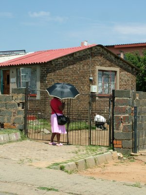 Lady at the Gate Soweto.JPG