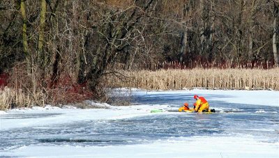 Rescue Team On Icy River