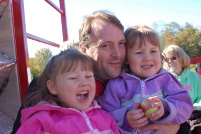 Daddy and his girls on the hay ride
