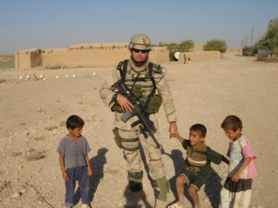 TSgt. Jason Somers with Iraq Children