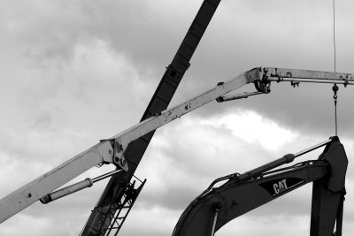 two cranes & a caterpillar