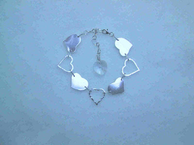 This adjustable bracelet is 23cm in length, with a crystal heart dangle on the end of the handmade chain.