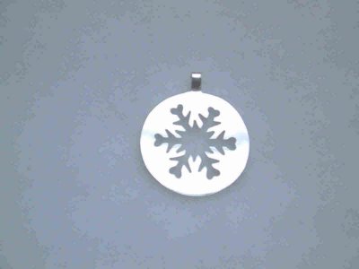 This cut-out snowflake pin is about 3.5cm in diameter. (the bail was removed and a pin-back soldered on)