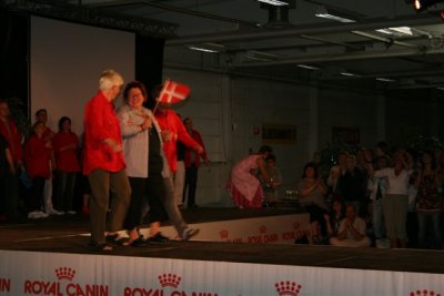 Lone Lund walking with her assistants