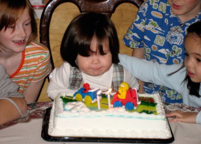 Trying REALLY hard to blow out the candles