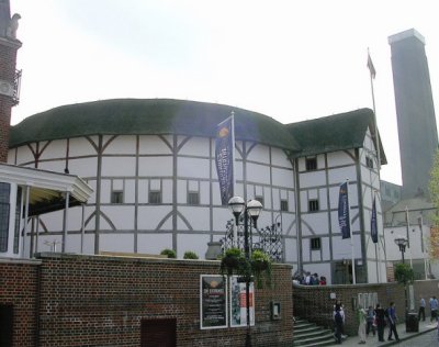 The Globe Theater with the Tate Modern Museum Column in the background