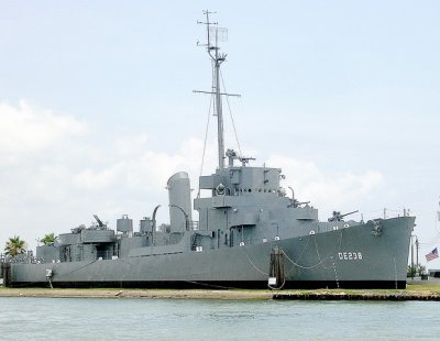 WW II troop ship cuts through the grass