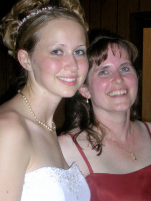 The bride with mom sighing with relief that it's over