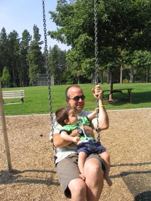 Henry inspects the durability of the chain prior to swinging while Daddy describes its tensile strength characteristics