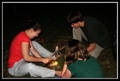 Opening the coconuts with primitive tools