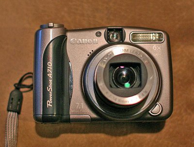  Canon 710 Camera , 7.1 Mega Pixs  and IS  ( Uses, just two AA batteries)