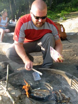  Chief Paul Cooking Fish And Usiong Stick To Apply Butter