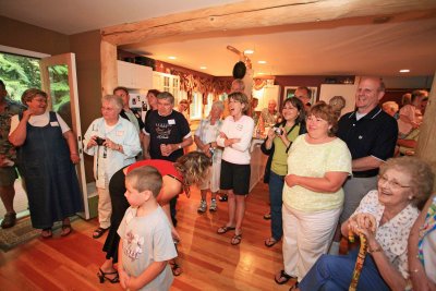 Crowd Watches As They Cut Up The Top Of 50 Year Old Cake!!!!!!