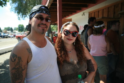 Happy Stampede Couple ( Great Tatoos And Lip Stick!)