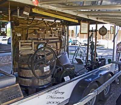 New invention. Gasoline powered motor turns agitator in wood barrel to wash clothes. Only takes up half a garage.