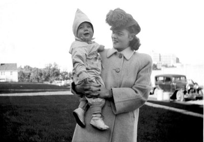 Mom holding me, Milwaukee 1942.
