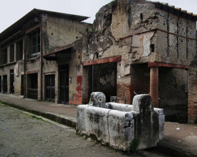 Drinking trough and two storey buildings 