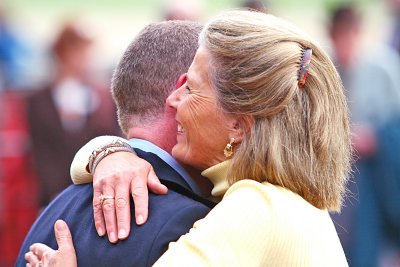 Owners Embrace In Winner's Circle