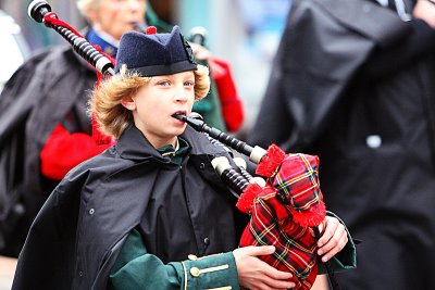 Bagpiper With Rain Gear and Sideways Look