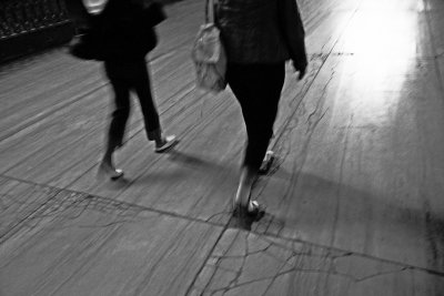 Two Women Walking Over Smooth Stone