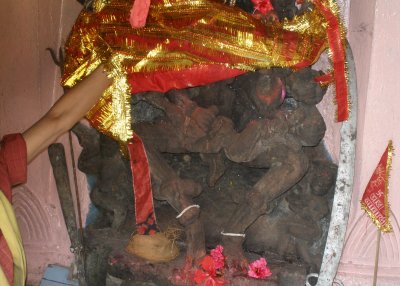 Kali's victim, laid across her knees