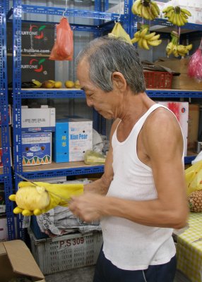 Cutting up jack fruit, Geylang market