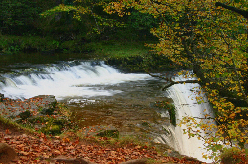 Autumn waterfall scene in Wales.