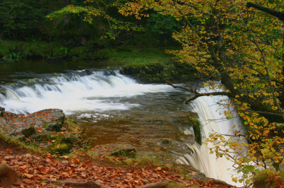 Autumn waterfall scene in Wales.