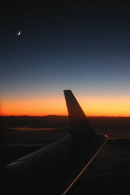 On the wings of a sunset and moon.