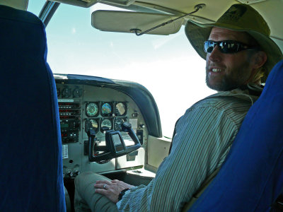 Clint learns to pilot the plane as right seat