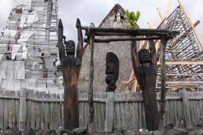 Wooden carvings in front of the Ahuena Heiau