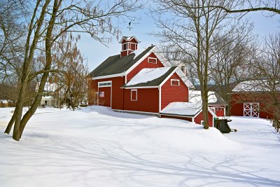 Country barn in spring snow