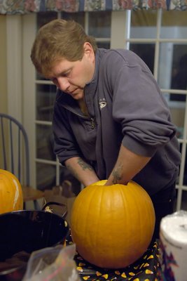 Joe guts his pumpkin