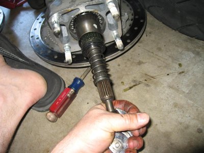 If you aren't going to re-use the old drive, you can remove the input shaft to use to help you guide drive shaft into place