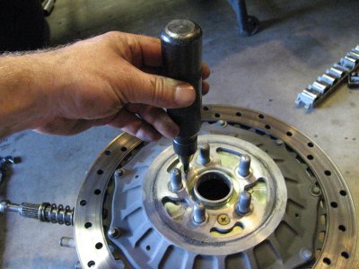 You need an impact wrench to remove the screws on the rotor