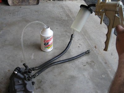 Before I installed the new caliper, I filled it and the hoses with fluid by using the MityVac to draw fluid into it.