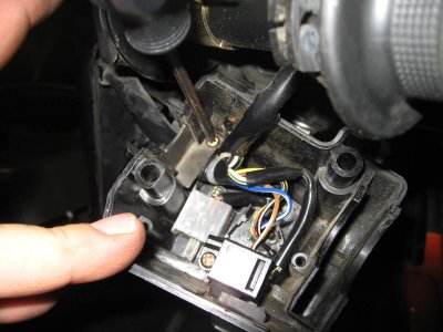 Seperate the halves of the throttle control assy to get to the starter switch. Remove harness clamp to give yourself slack