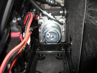 ABS pump is behind battery