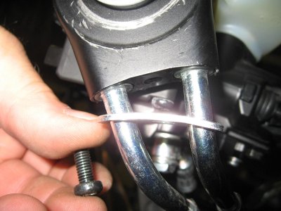 Remove screw on bottom of throttle cables