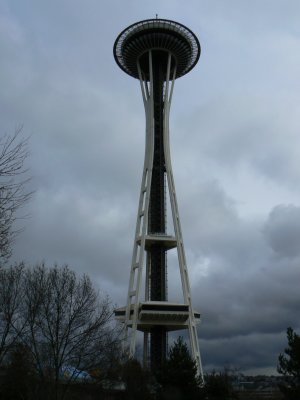 Space Needle under early clouds