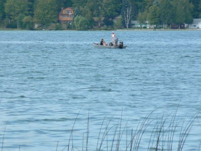 Fisher people enjoying the lake
