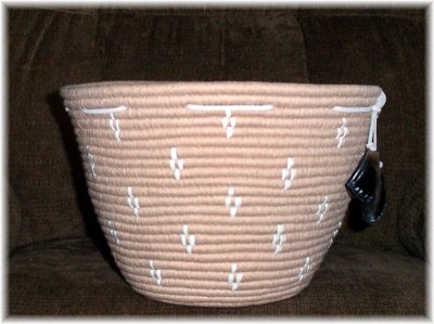 Plateau Huckleberry Basket with carved deer toe decorations.