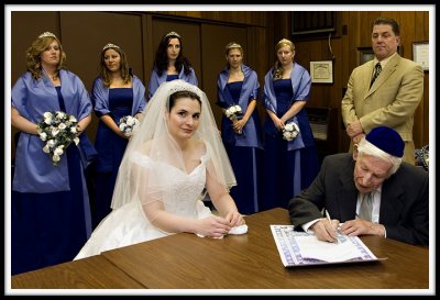 The Bride Looks into the Lens at the Ketubah Signing Ceremony