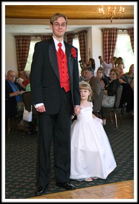 A Groomsman and the Flower Girl Make an Entrance