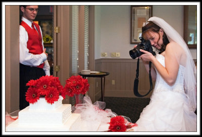 The Photograher Shoots the Cake at her Own Wedding