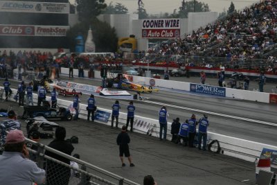 Start of Top Fuel qualifying with Hillary Will in left lane .