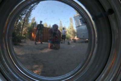Reflection in  Lynda's Tear Drop trailer wheel .